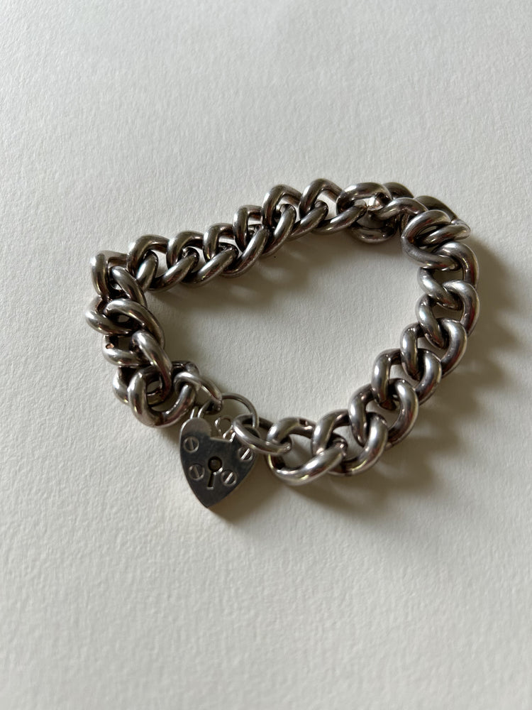 Chunky silver curb bracelet with heart padlock