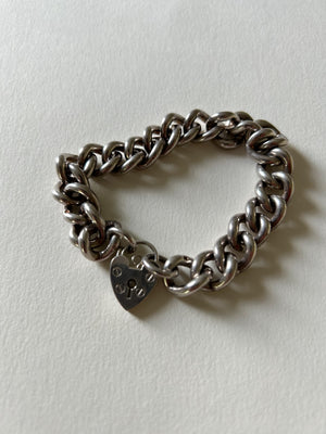 Chunky silver curb bracelet with heart padlock