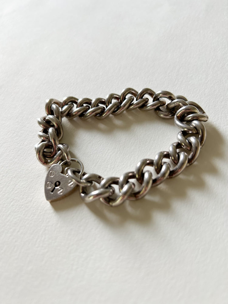 Chunky silver curb bracelet with heart padlock