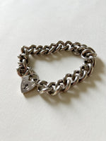 Chunky silver curb bracelet with heart padlock