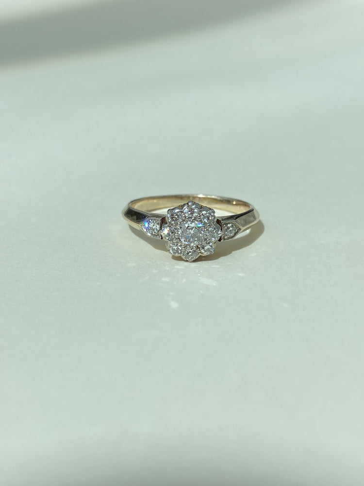 Diamond cluster ring with diamond shoulders