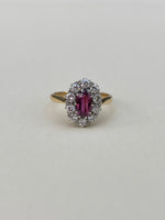Oval ruby & diamond cluster ring in platinum & 18ct yellow gold